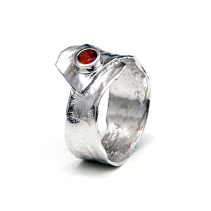 Metal silver ring with red cubic zirconia stone