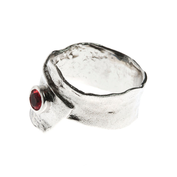 Metal silver ring with red cubic zirconia stone