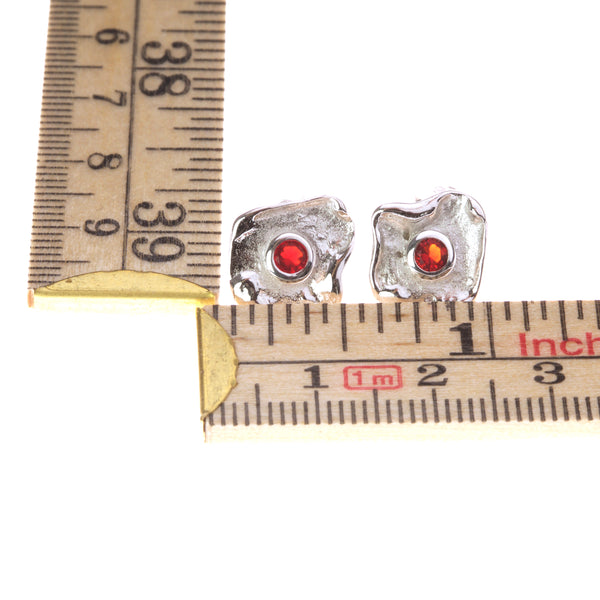 Metal sterling silver earrings with red zirconia stone
